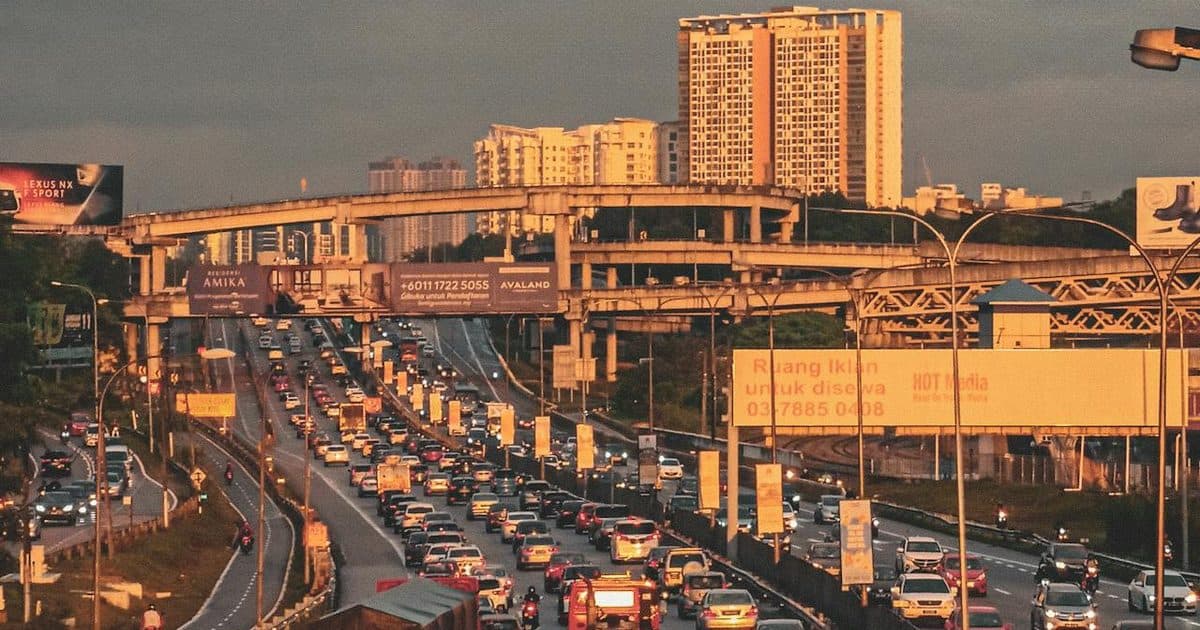 Highway traffic in Kuala Lumpur at sunset